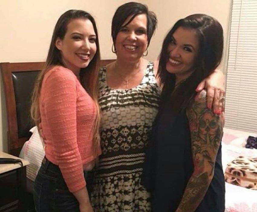 Eddie Guerrero's wife Vickie and daughters with big smiles